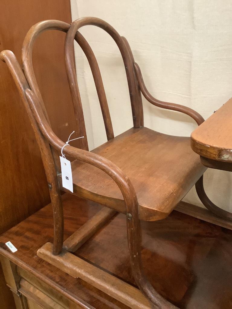 An early 20th century child's bentwood desk / chair, width 78cm depth 46cm height 57cm